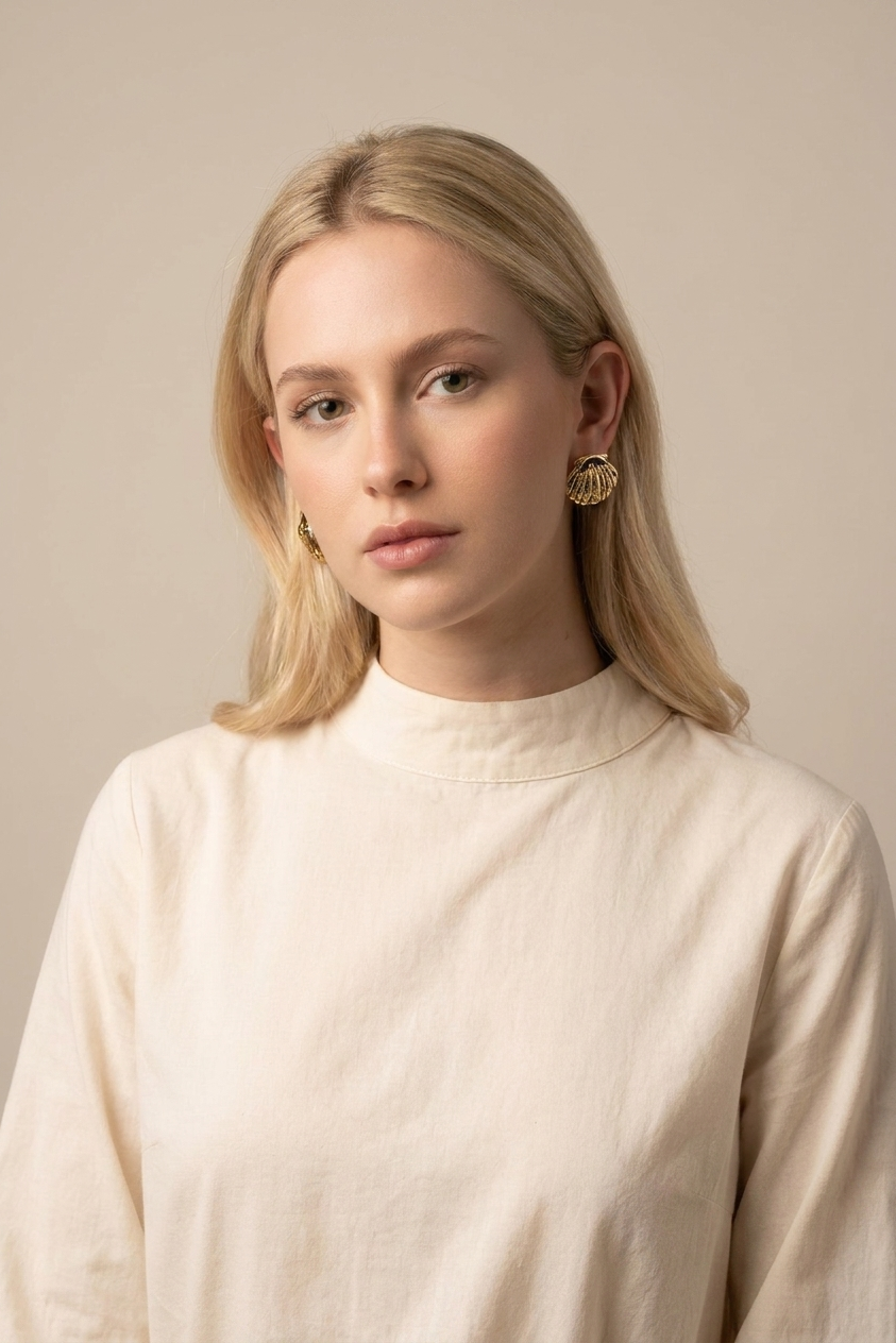A pair of gold dome earrings