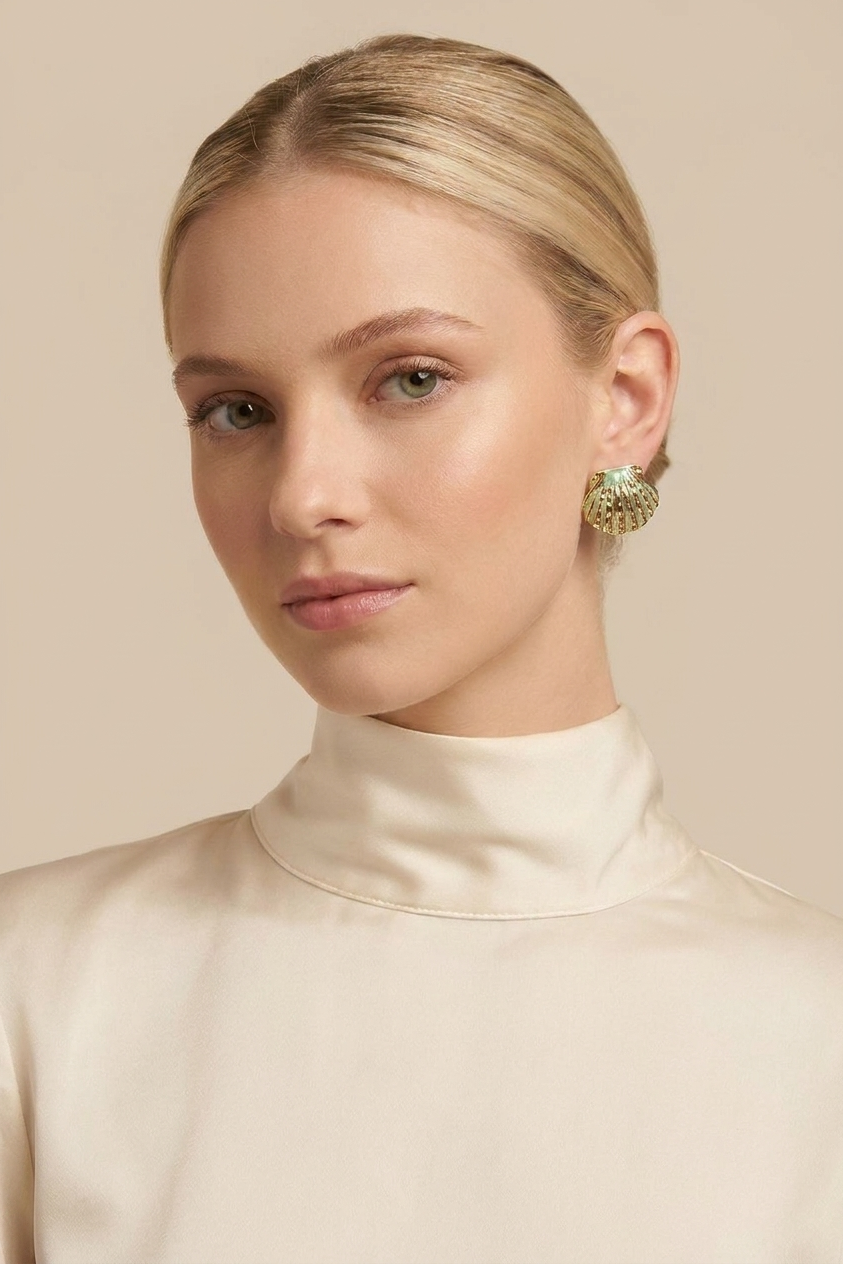 A pair of gold dome earrings