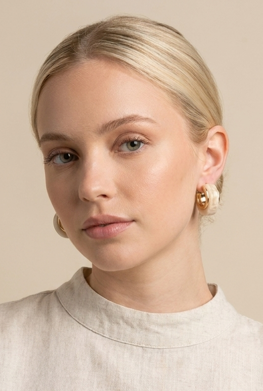 A pair of gold dome earrings