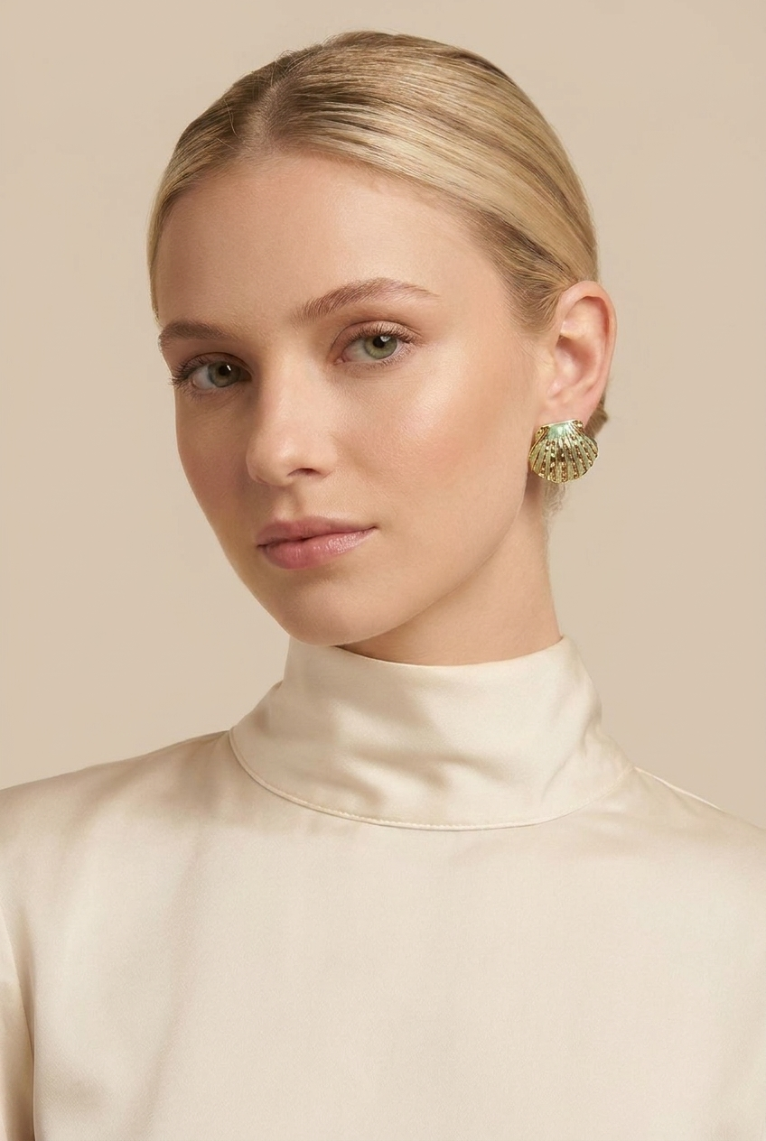 A pair of gold dome earrings