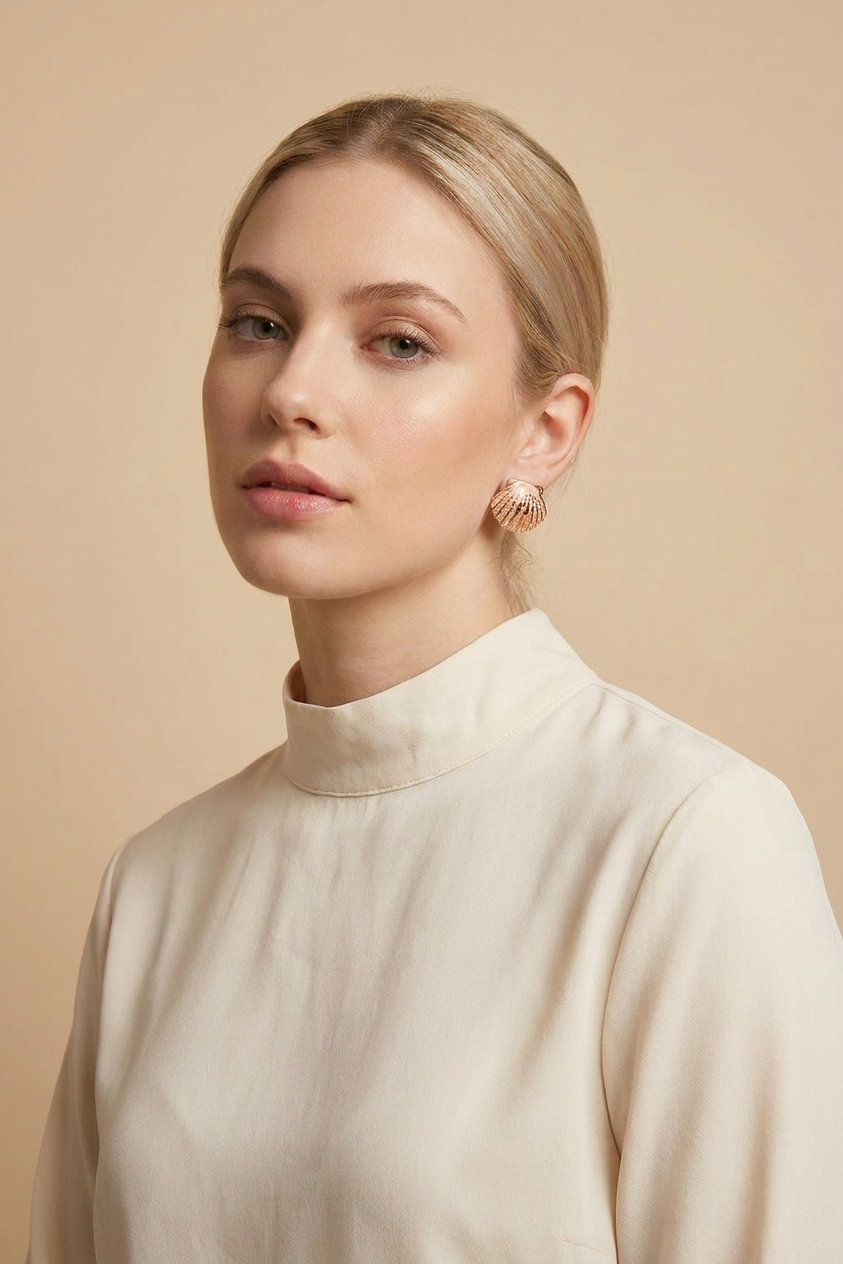 A pair of gold dome earrings