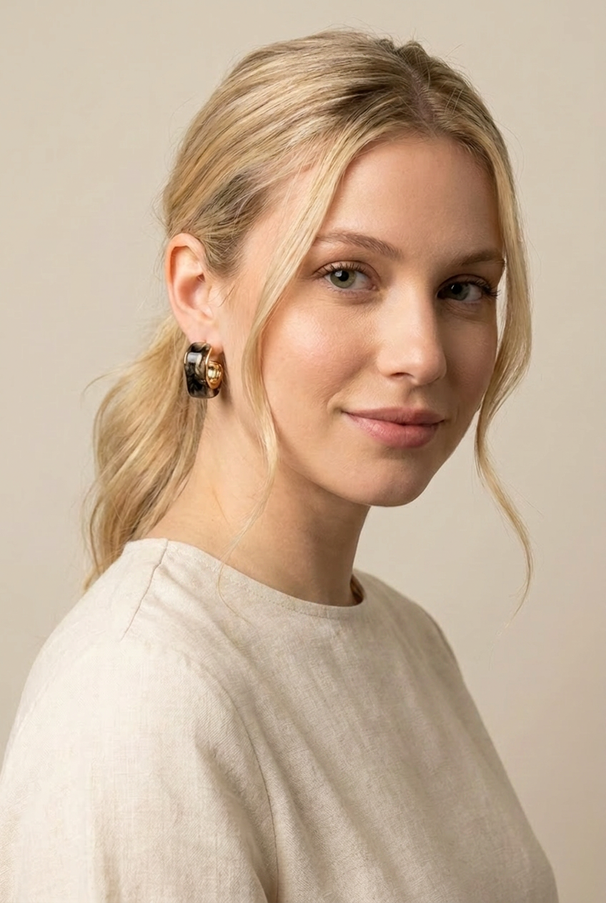 A pair of gold dome earrings